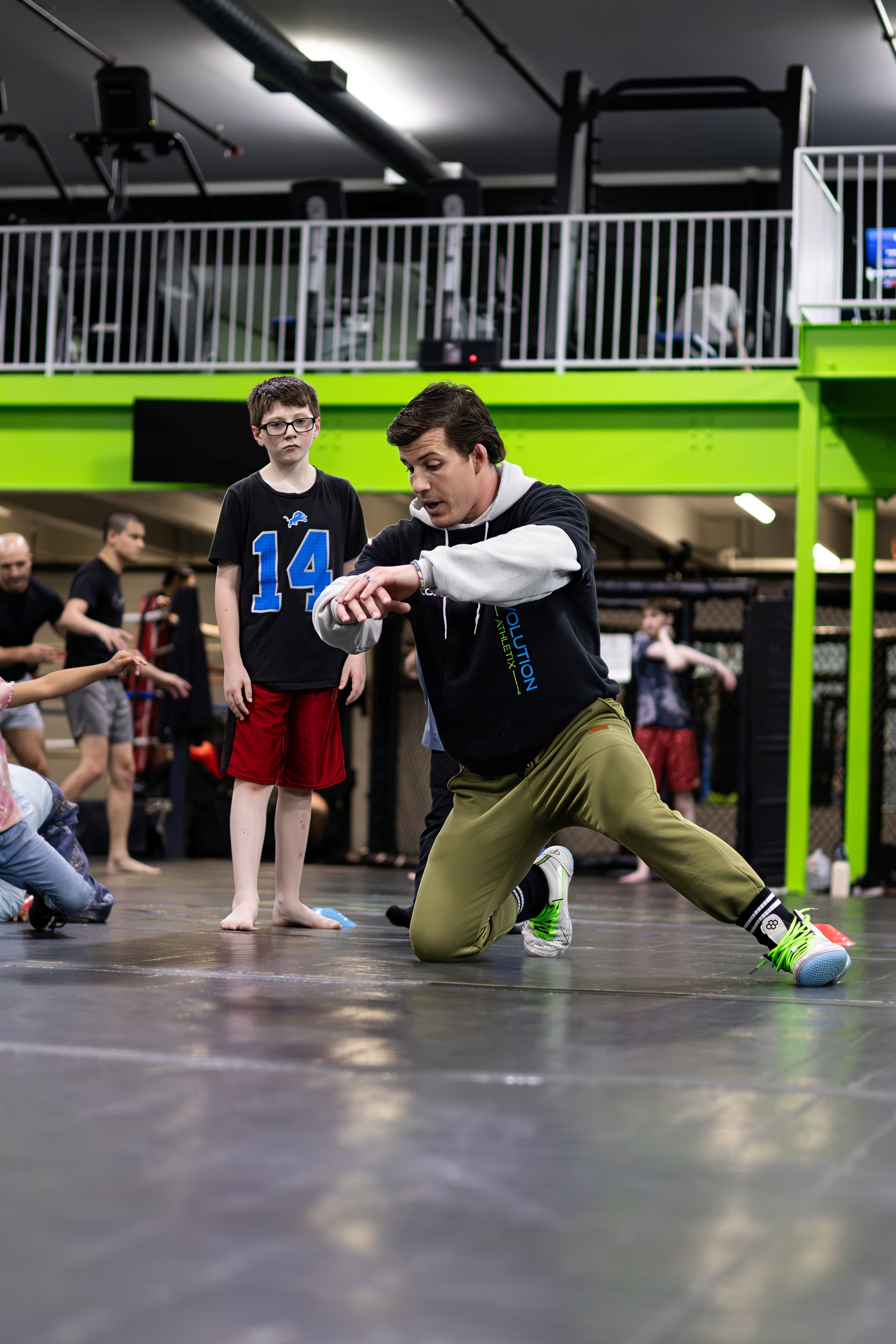 Young athletes practicing wrestling drills